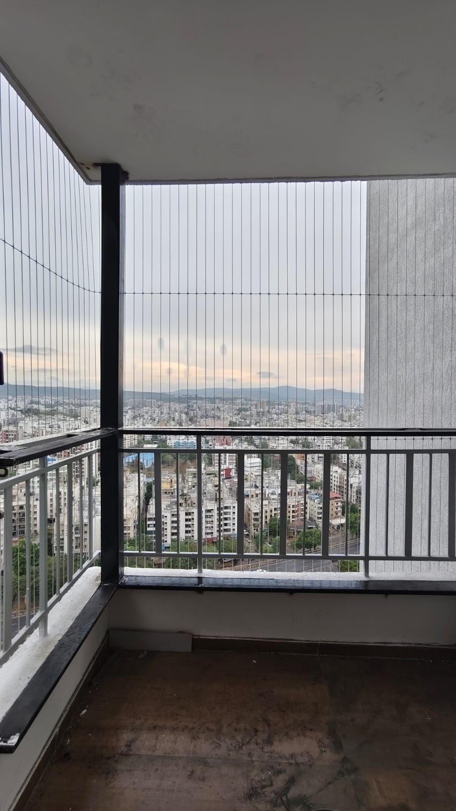 Invisible safety grills protecting family balcony
